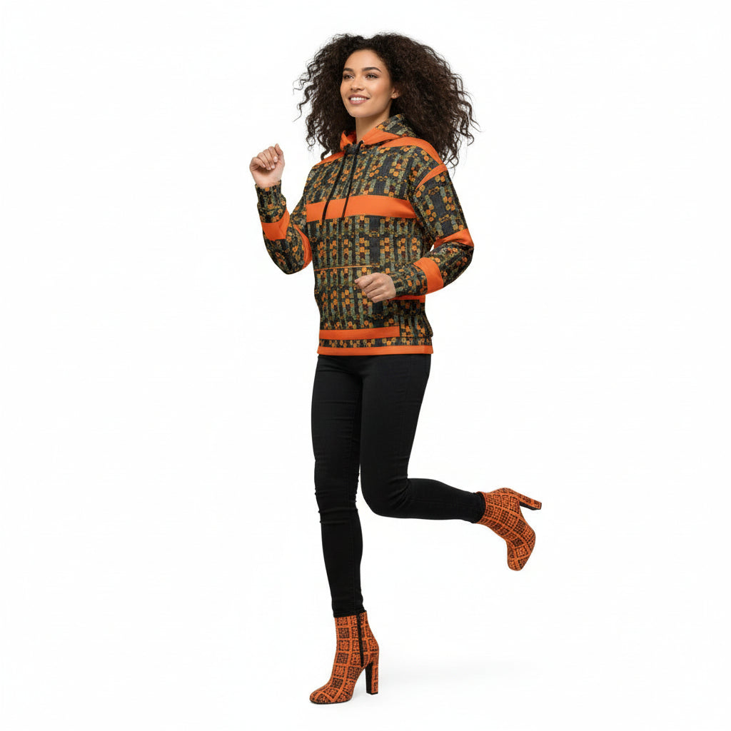 Person wearing a patterned hoodie with orange accents on a white background