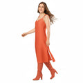 wearing same colour as dress thigh high stiletto boots. walking with hair flowing