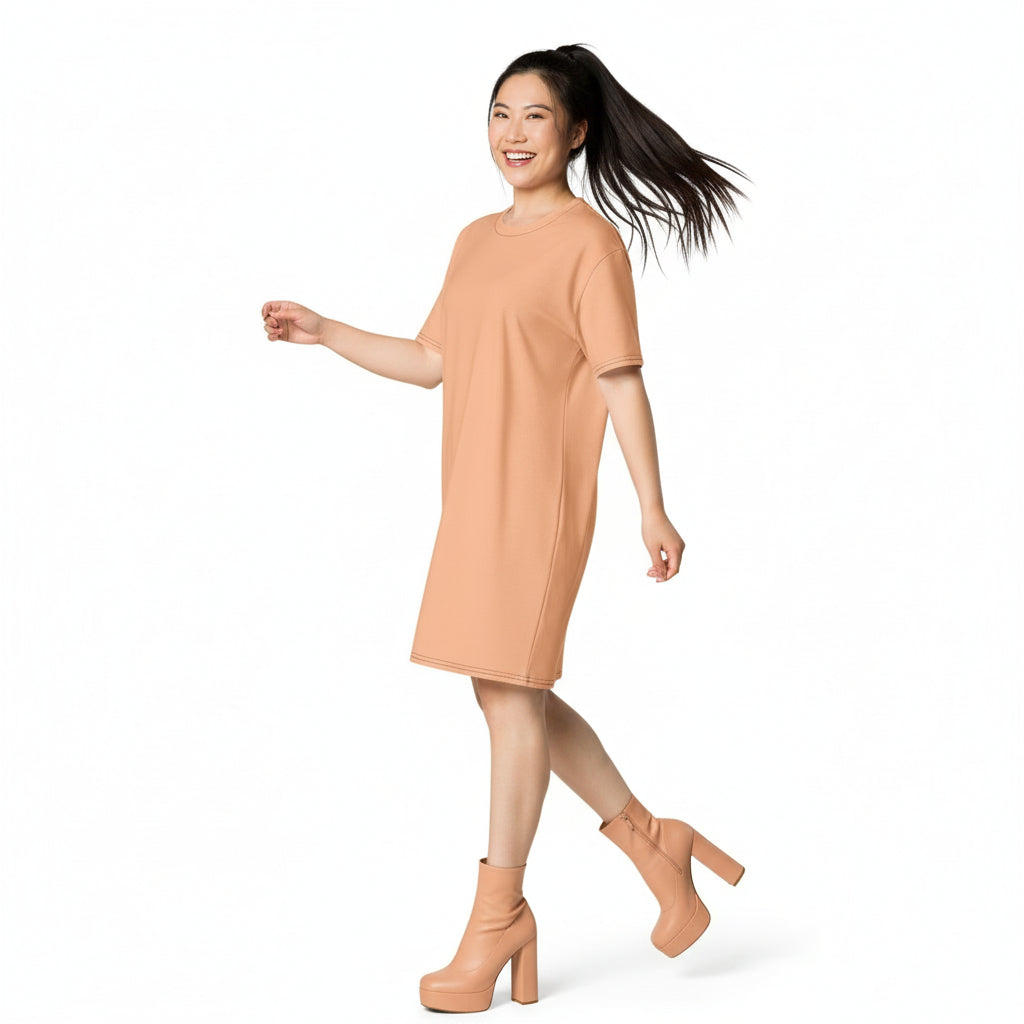 Woman wearing a beige dress and high heels on a white background
