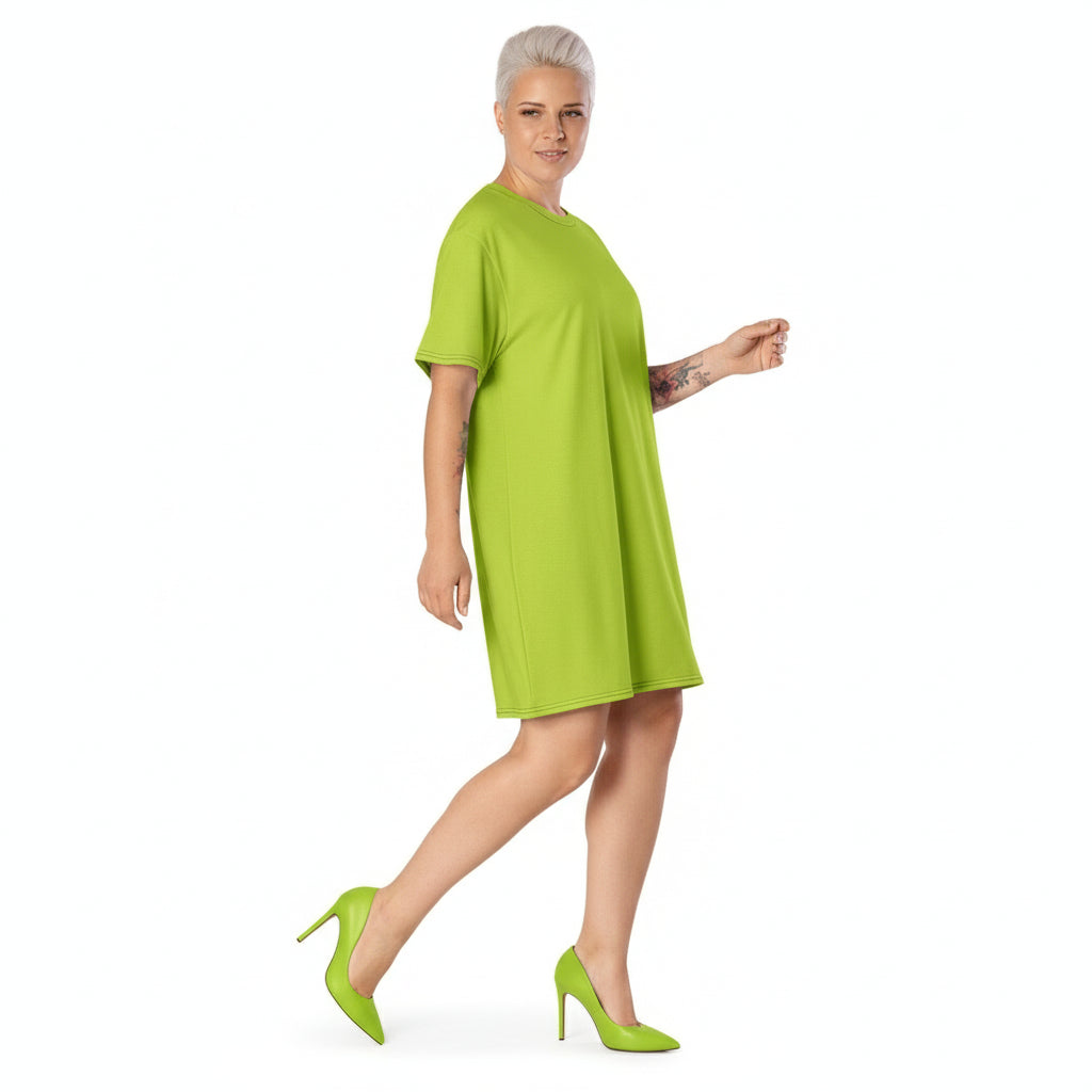 Woman wearing a green dress and shoes on a white background