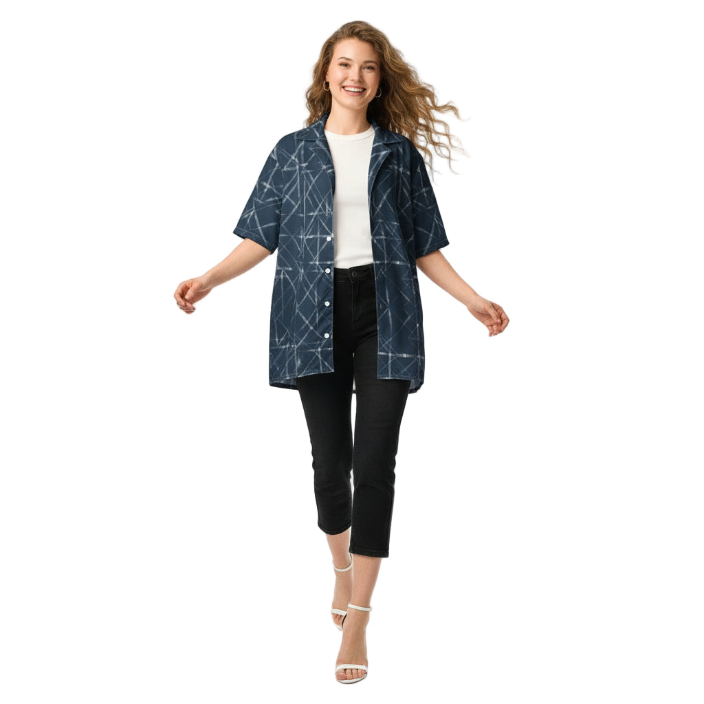 Woman wearing a blue geometric patterned shirt on a white background