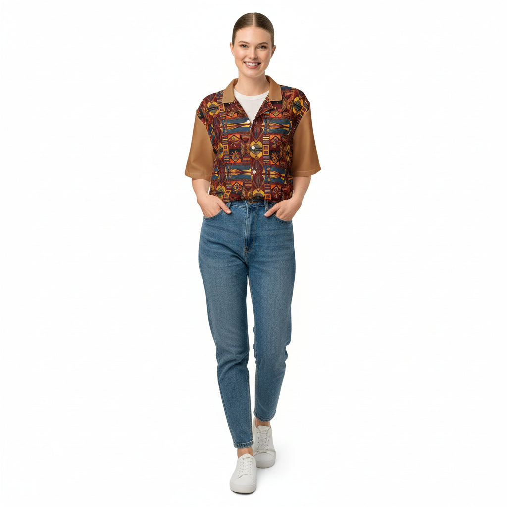 Woman wearing a patterned shirt over a white top with jeans on a white background