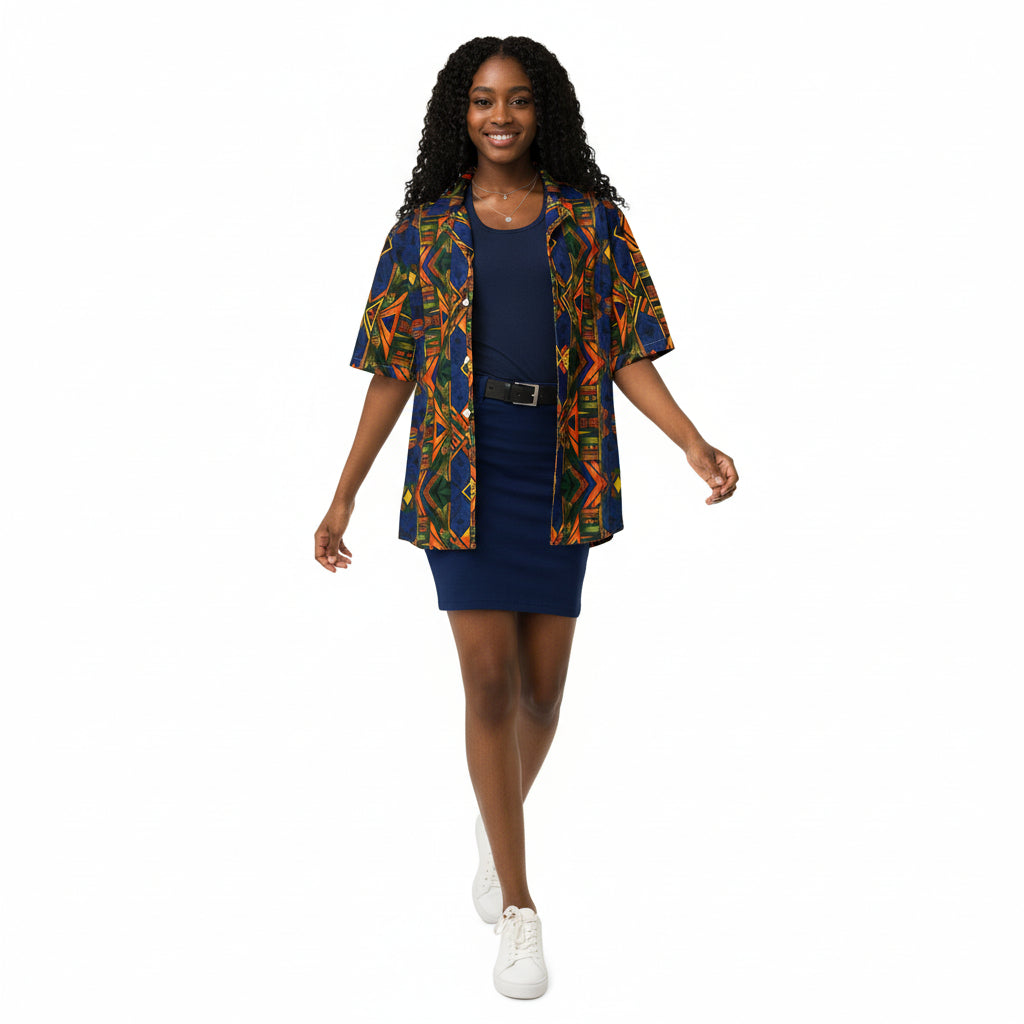 Woman wearing a colorful patterned shirt and navy skirt against a plain background
