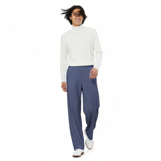 Person wearing a white turtle neck sweater and blue pants on a white background