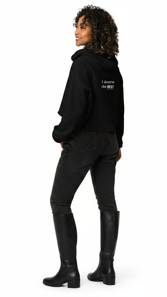 Person wearing a black hoodie with 'I deserve the BEST' text on the back, standing against a white background.
