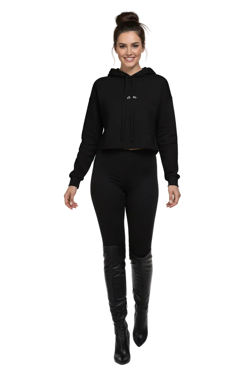Person wearing a black hoodie with white text on a white background